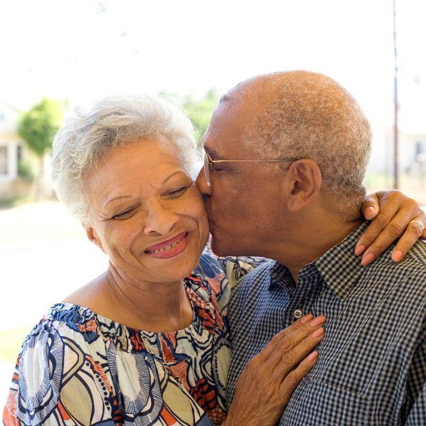 Husband kissing his wife on the cheek
