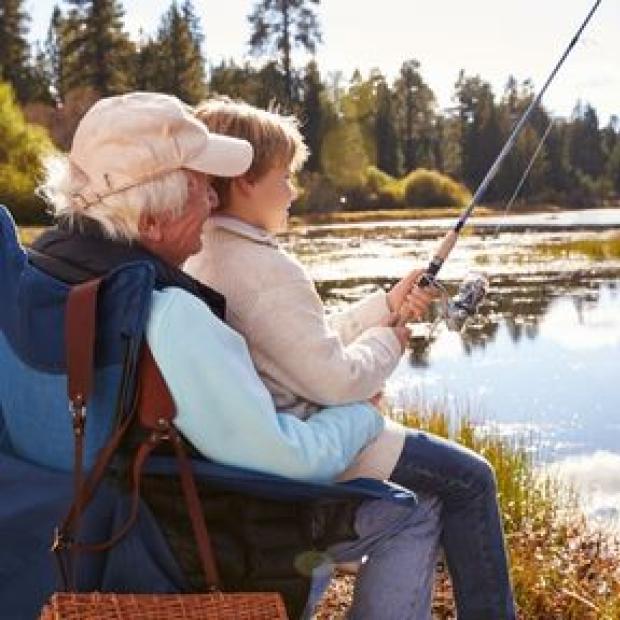 Grandpa fishing with his grandson