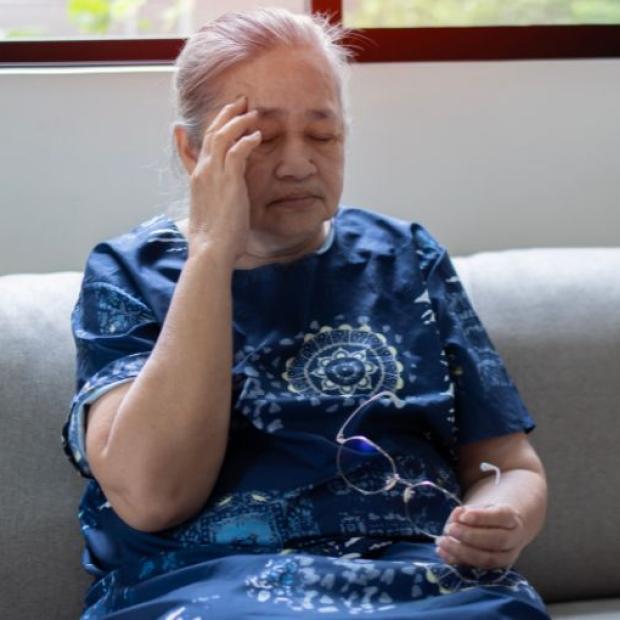 Lady holding her head