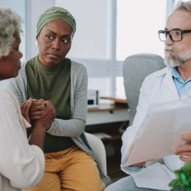 Mother and daughter meeting with doctor