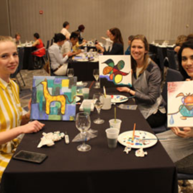 group of women doing paint night