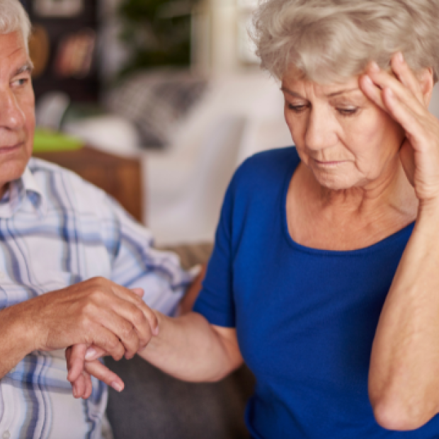 Woman holding her head in pain
