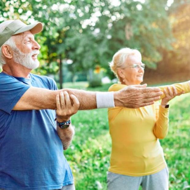 Seniors stretching outdoors