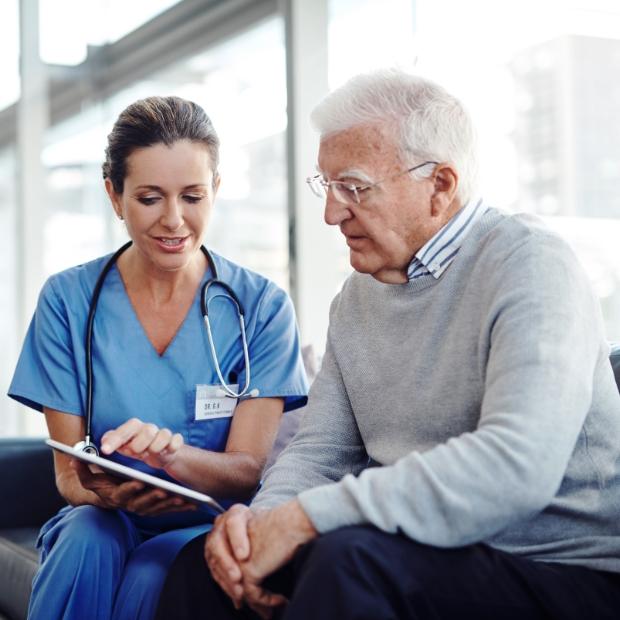 Nurse reviewing paperwork with her patient