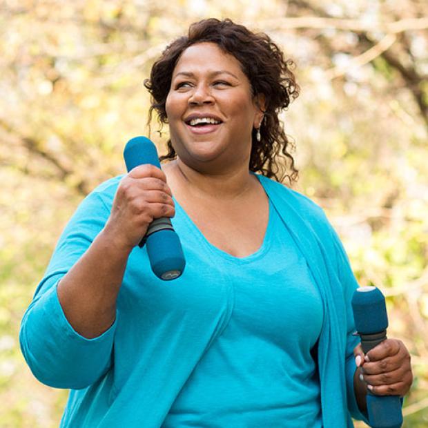 Woman walking with light weights
