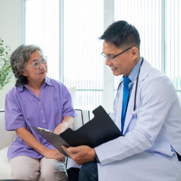 Doctor talking to senior female patient