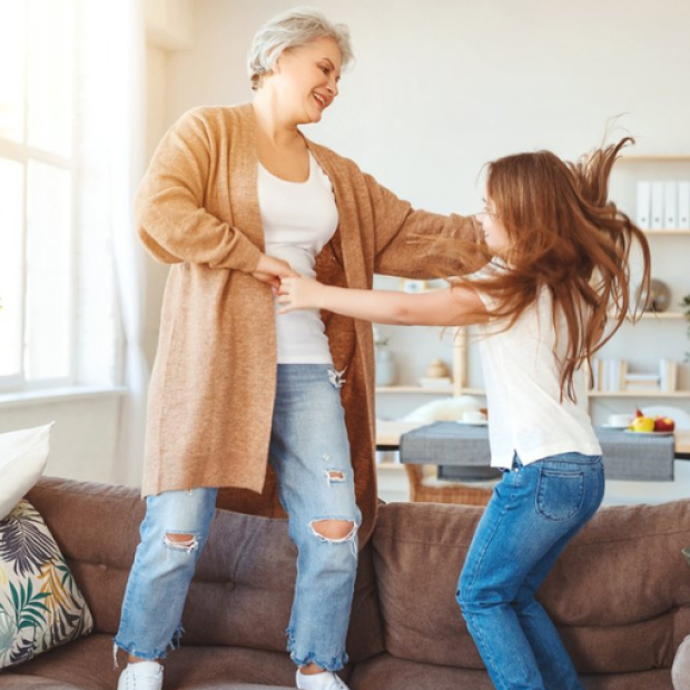 Grandmother dancing with granddaughter