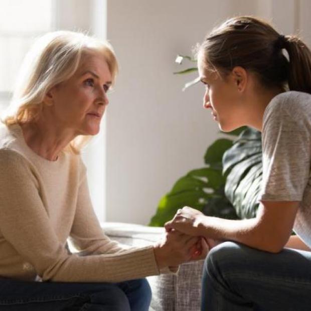Woman talking to her daughter