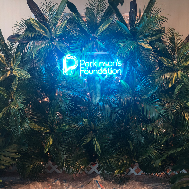 Parkinson's Foundation logo in blue neon light
