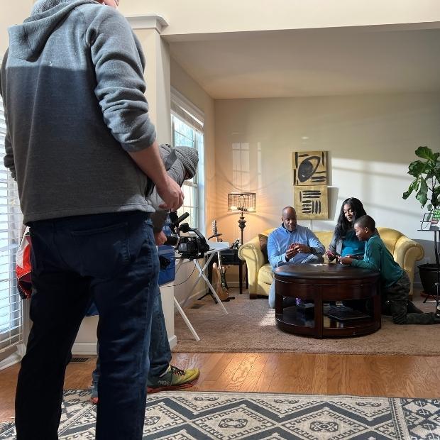 Cameraman films family playing cards in the Parkinson's Foundation PSA