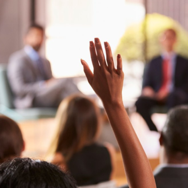 raising hands in a conference