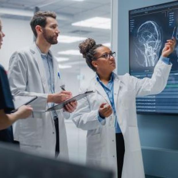 Neurologists looking at brain scans