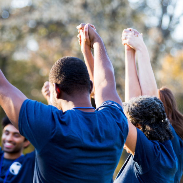 Group of people holding hands