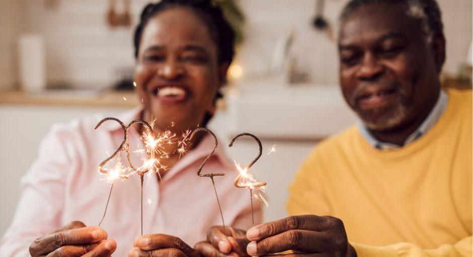 Husband and wife holding 2022 sparklers