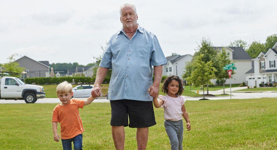 Grandpa walking with grandson and granddaughter