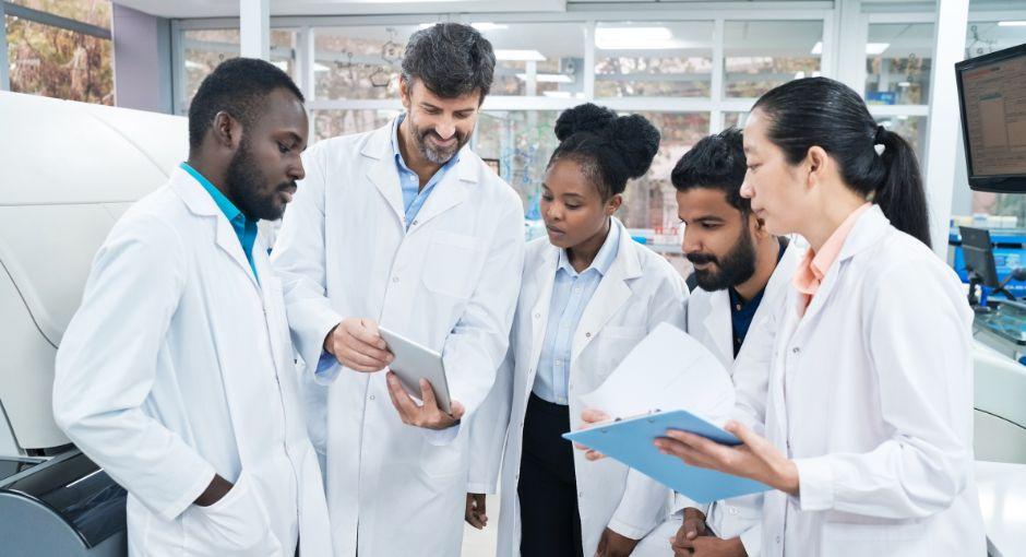 Group of researchers in the lab talking