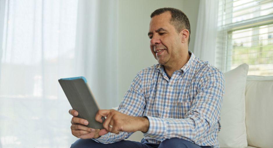 Man looking at tablet