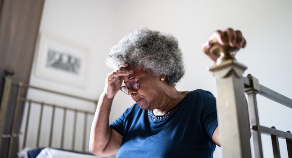 Older woman hunched over in pain
