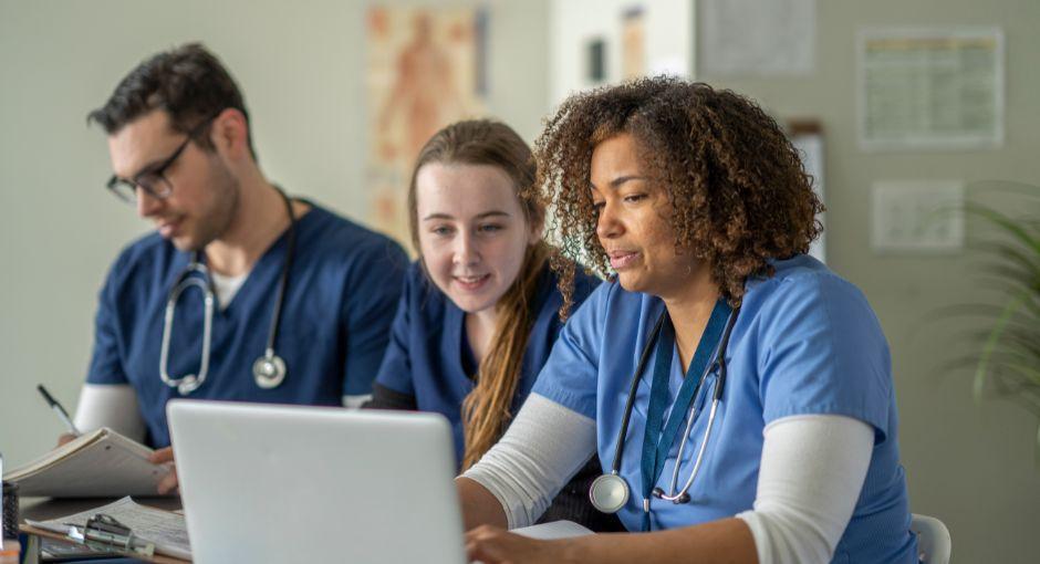 Group of healthcare professionals on laptop