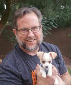 Mark Milow holding a puppy