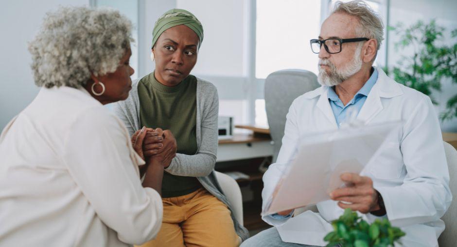 Mother and daughter meeting with doctor