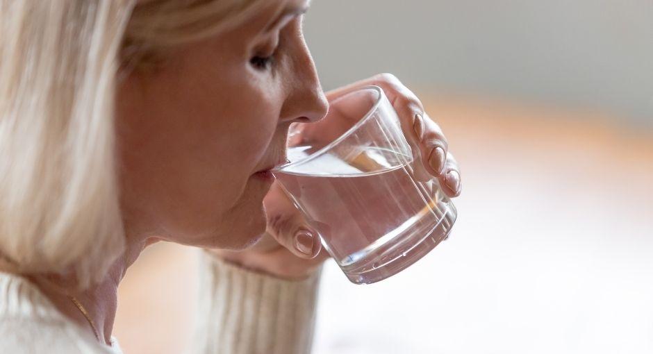 Woman drinking water from a glass