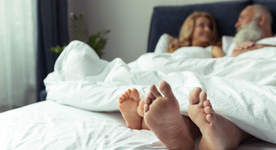 Couple laying in bed together