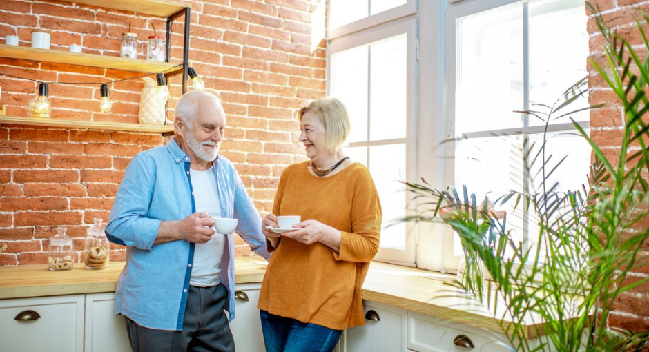 Couple laughing in the kitchen