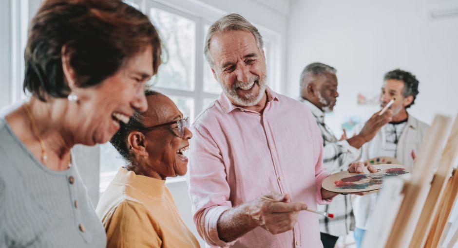 Senior adults in a painting class.