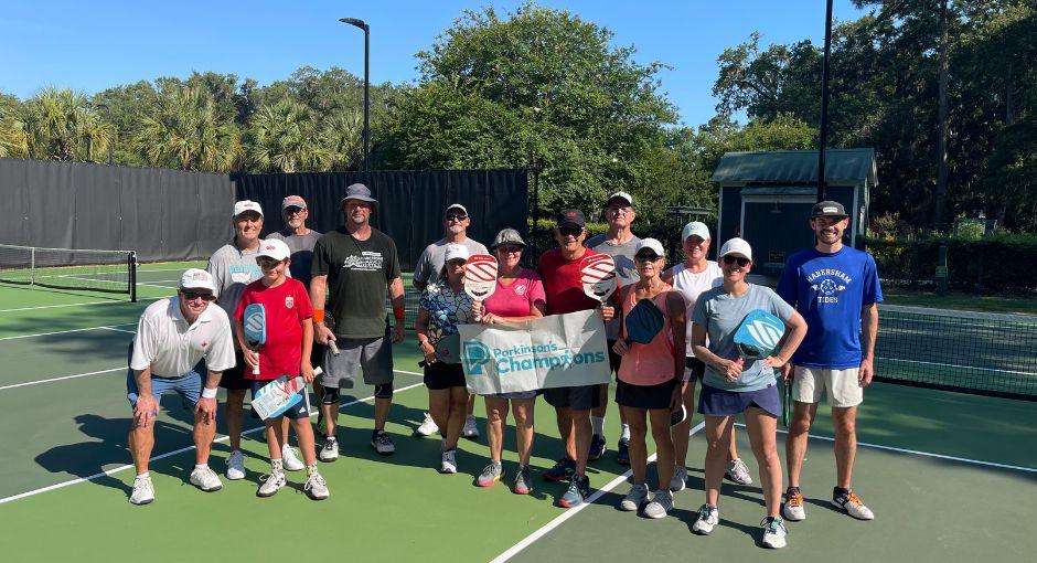 Group playing pickleball for a Champion's event