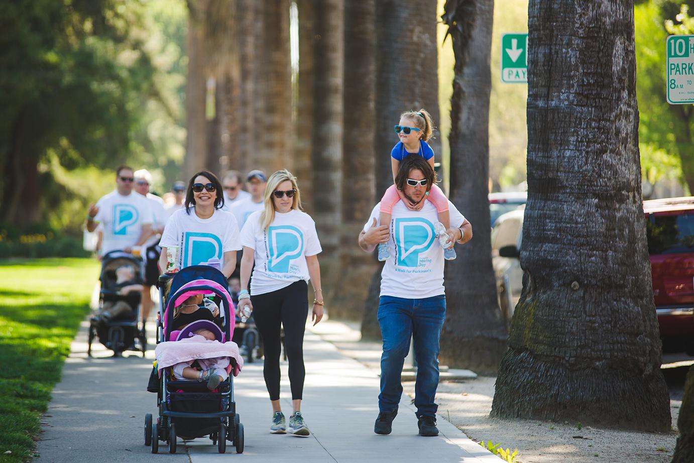 Young family participating in Moving Day, a walk for Parkinson's