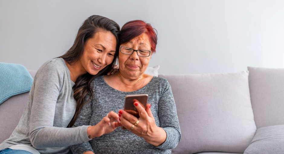 Older and younger women using a smart phone