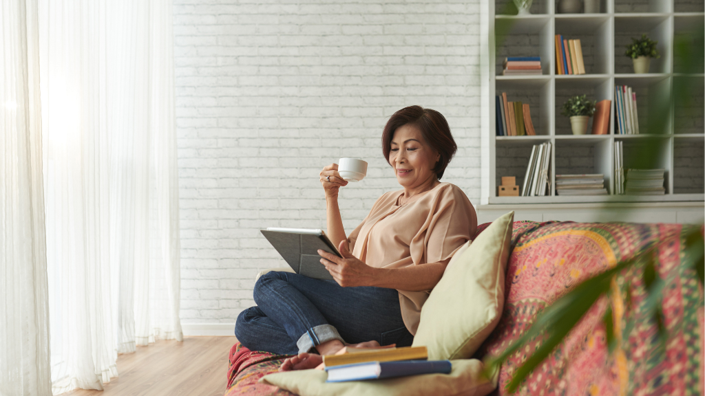 Woman relaxing on the couch drinking coffee