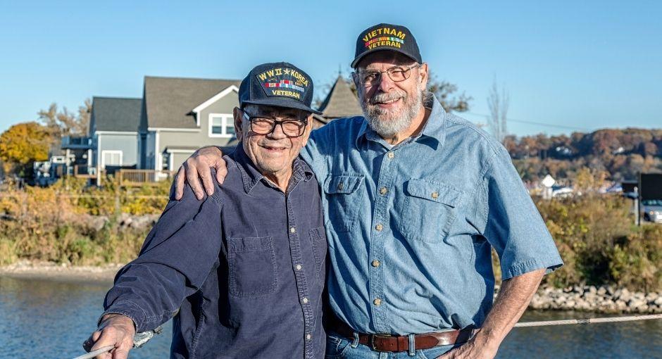 Two veterans with their arms around each other