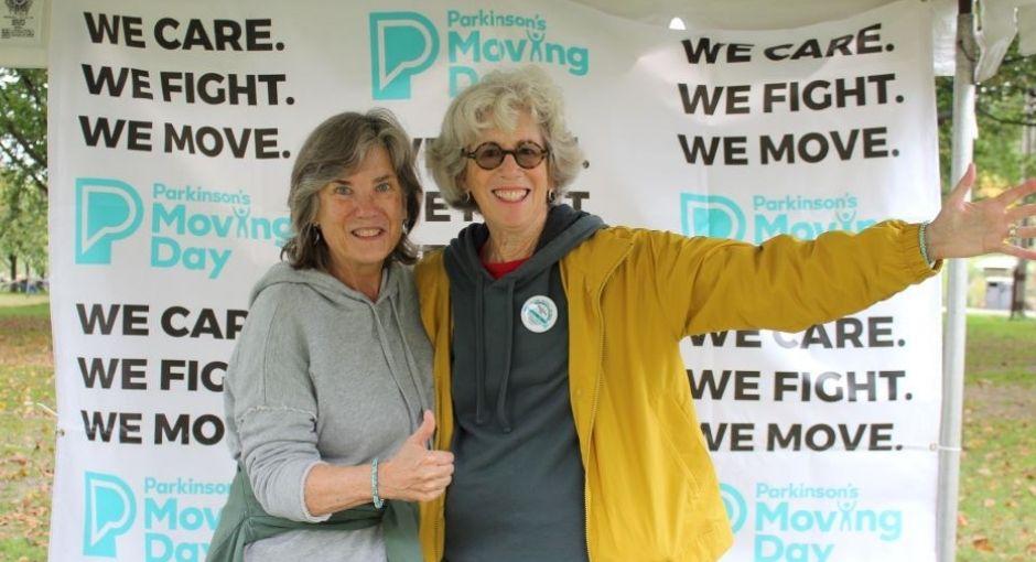 Two women posing at a Moving Day event