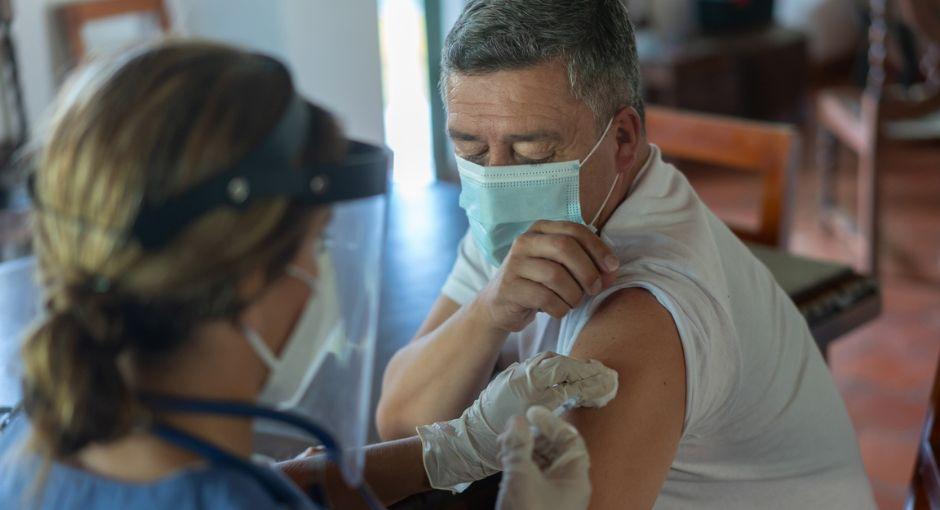 Person receiving a COVID vaccination