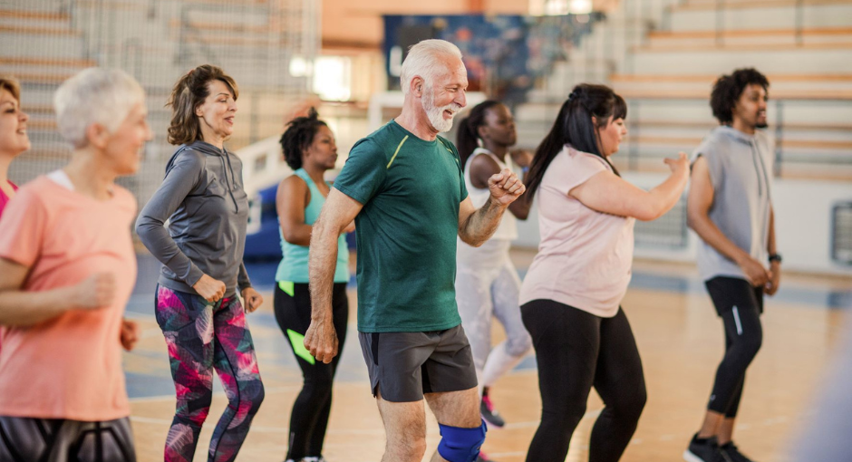 Group of people dancing at exercise class