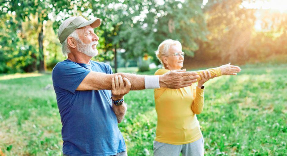 Seniors stretching outdoors