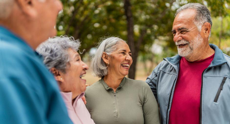 Group of senior friends laughing together outside