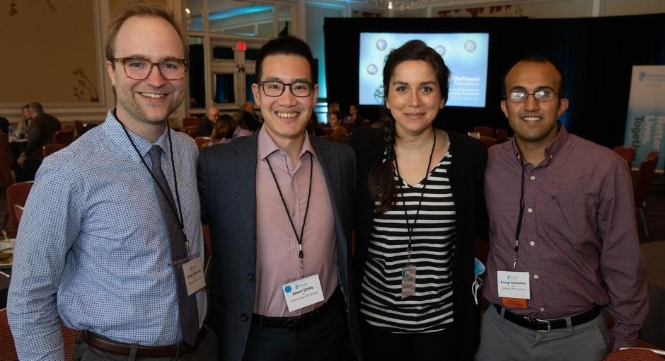 Four healthcare professionals from the Parkinson's Foundation Global Care Network pose together