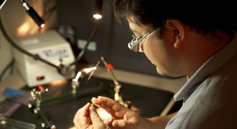 Researcher looking at object