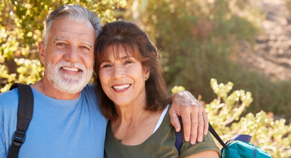 Couple hugging while hiking