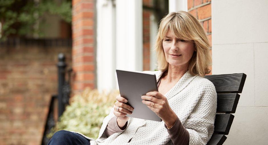 Woman using tablet outside
