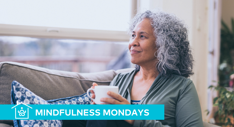 Woman sitting on the couch drinking coffee