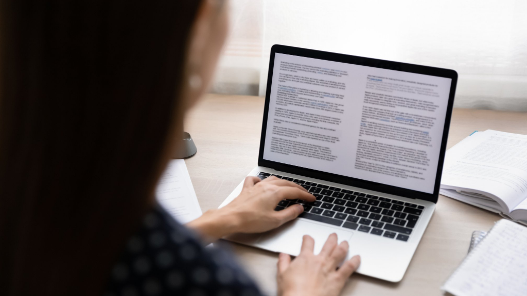 Woman typing on computer