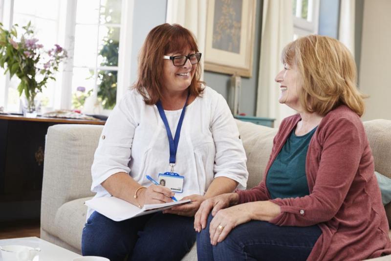 Woman talking to doctor