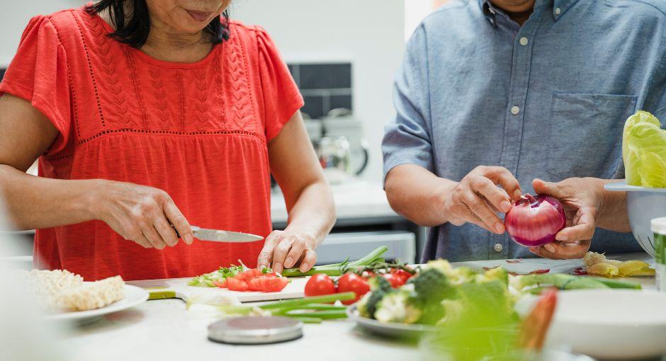 Two people preparing a meal together