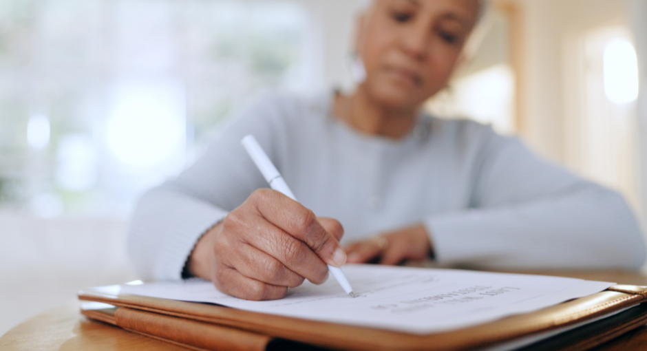 cropped image of an older lady filling out a survey