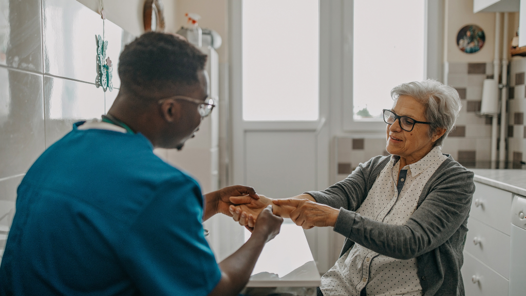 Nurse checking patient's hands