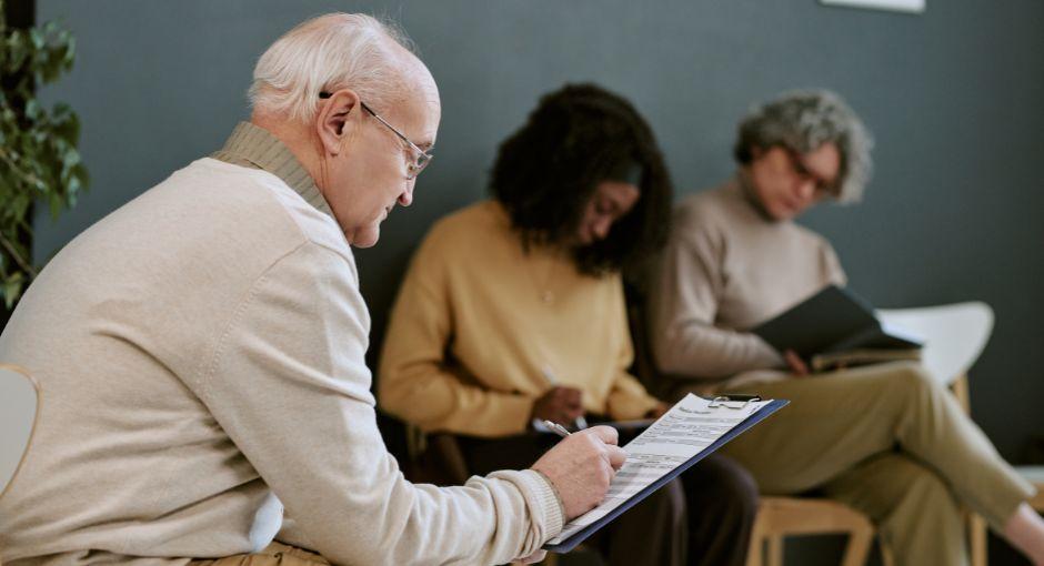 Group of people filling out a form